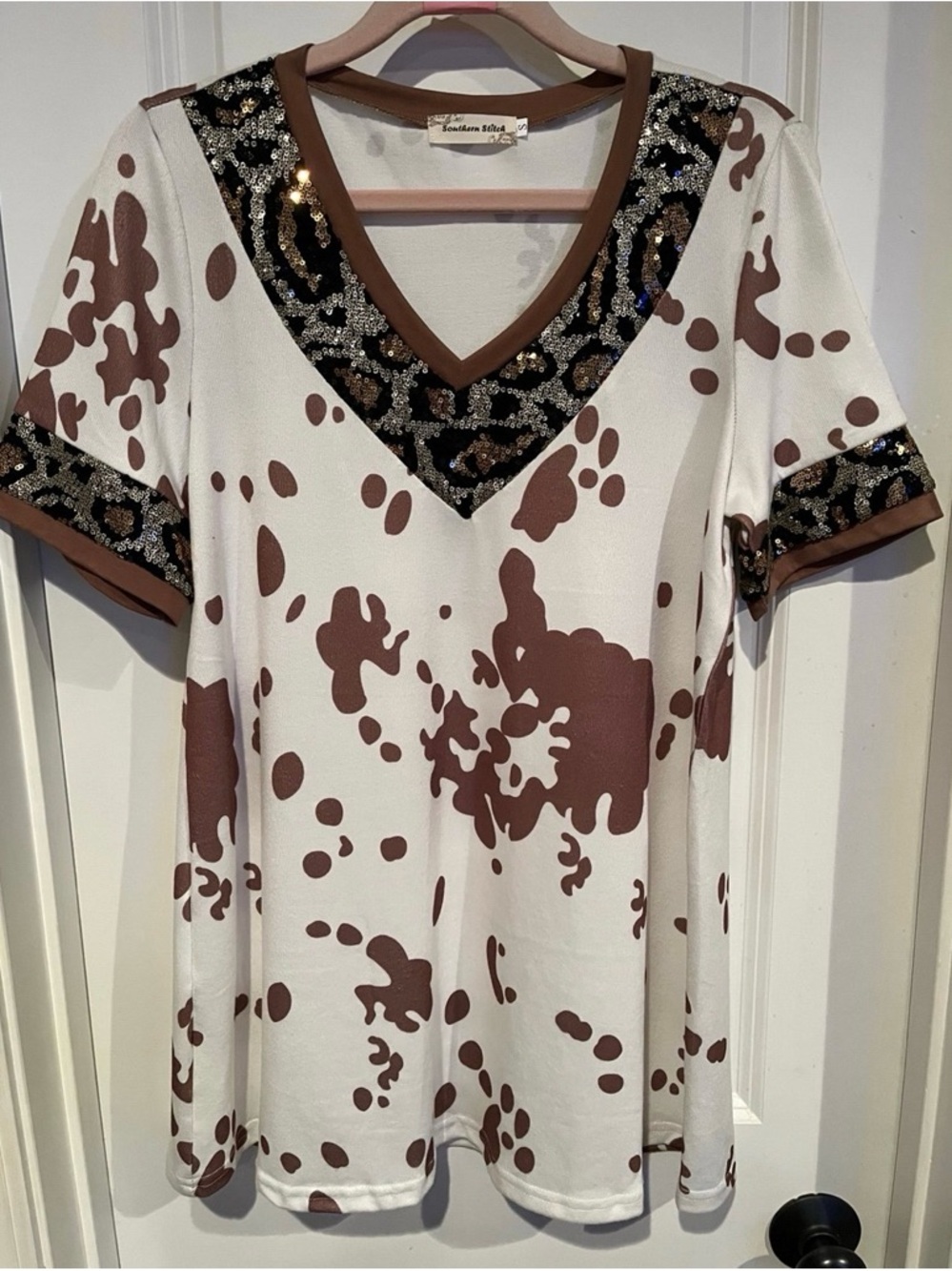 Southern Stitch Cow Print V-Neck Sequin Trim Short Sleeve Top